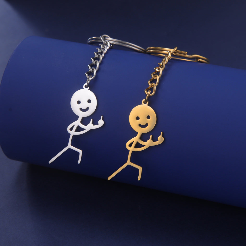 Cute And Creative Emoji Pendant Featuring A Little Figure Giving Two Middle Fingers On One Side Made From Stainless Steel As A Keychain