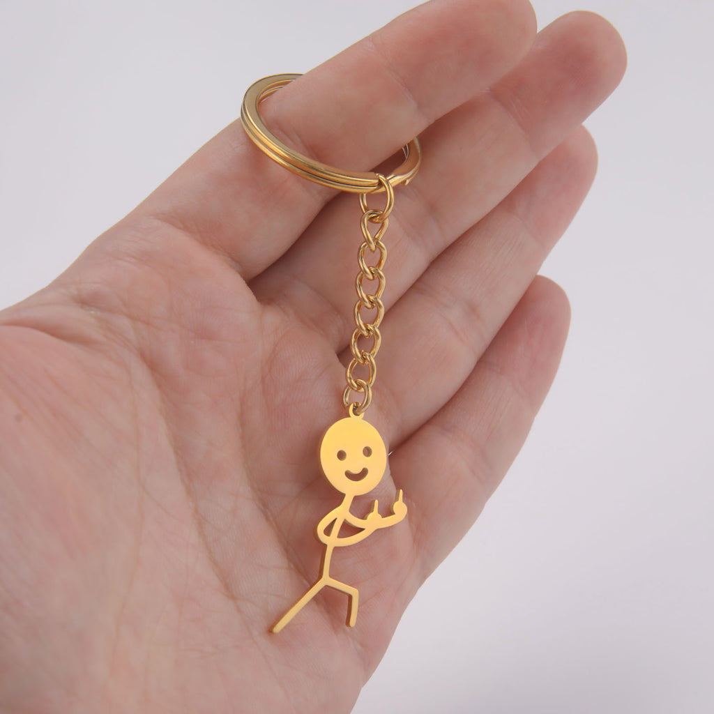 Cute And Creative Emoji Pendant Featuring A Little Figure Giving Two Middle Fingers On One Side Made From Stainless Steel As A Keychain