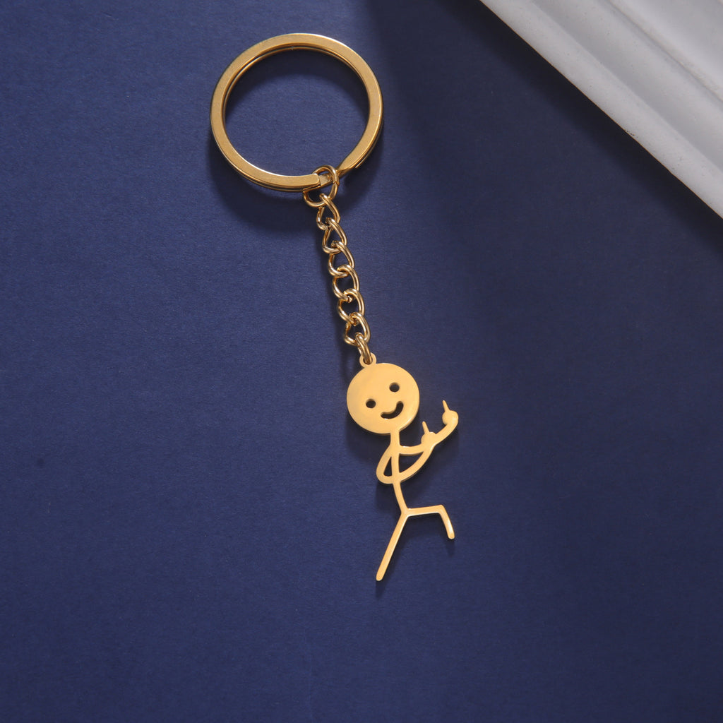 Cute And Creative Emoji Pendant Featuring A Little Figure Giving Two Middle Fingers On One Side Made From Stainless Steel As A Keychain